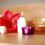 lit candle and flower relaxing display